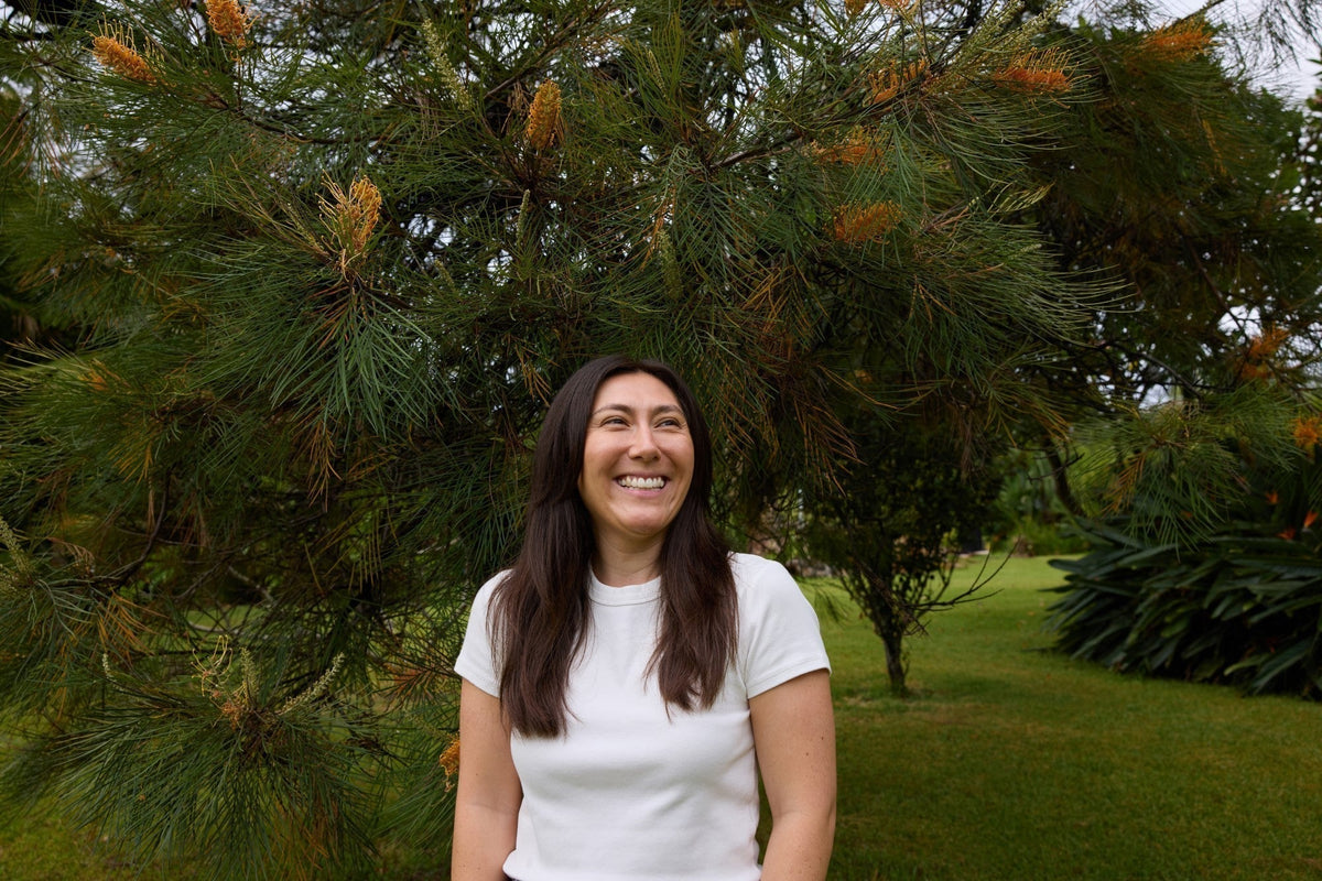 smiling woman standing in the park